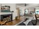 Comfortable sitting area in the primary bedroom with fireplace and views of the bedroom and bathroom at 8209 Beech Knoll, Indianapolis, IN 46256