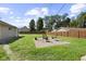 Spacious backyard featuring a concrete patio with seating and a well-maintained lawn at 909 E Markwood Ave, Indianapolis, IN 46227