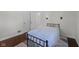 Cozy bedroom featuring a simple bed frame and a patterned rug at 909 E Markwood Ave, Indianapolis, IN 46227