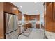 Modern kitchen with stainless steel appliances, ample counter space, and updated cabinetry at 909 E Markwood Ave, Indianapolis, IN 46227
