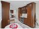 Gourmet kitchen featuring custom cabinetry, granite countertops, and stainless steel appliances at 909 E Markwood Ave, Indianapolis, IN 46227