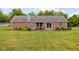 Spacious backyard with a patio, grill, and sprawling green lawn, ideal for recreation and relaxation at 9159 E County Road 400 N, Brownsburg, IN 46112