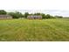 Large backyard with a well-kept lawn, offering plenty of space for outdoor enjoyment and activities at 9159 E County Road 400 N, Brownsburg, IN 46112