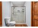 Bathroom showcasing a tiled shower with a glass door and modern fixtures at 9159 E County Road 400 N, Brownsburg, IN 46112