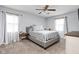 Cozy bedroom with a neutral color scheme, a ceiling fan, and natural light at 9159 E County Road 400 N, Brownsburg, IN 46112