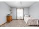 Comfortable bedroom with a single bed, side table, and carpeted floor, perfect for relaxation at 9159 E County Road 400 N, Brownsburg, IN 46112