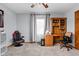 Versatile bedroom featuring a desk, gaming chair, and ample space for work or play at 9159 E County Road 400 N, Brownsburg, IN 46112
