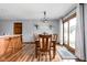 Dining area with wood table and chairs, leading to outdoor patio through sliding glass doors at 9159 E County Road 400 N, Brownsburg, IN 46112