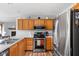 Updated kitchen featuring stainless steel appliances, ample storage, and a functional layout with light oak cabinetry at 9159 E County Road 400 N, Brownsburg, IN 46112