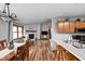 Open-concept living and dining area featuring hardwood floors and plenty of natural light and vaulted ceilings at 9159 E County Road 400 N, Brownsburg, IN 46112