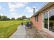 Cozy patio with a dining set, ideal for outdoor entertaining and enjoying the expansive lawn at 9159 E County Road 400 N, Brownsburg, IN 46112