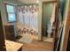 Bright bathroom features a shower, toilet, and neutral decor at 916 N County Road 500 E, Avon, IN 46123