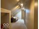 Upper-level hallway features natural lighting and a cozy seating area under a skylight at 916 N County Road 500 E, Avon, IN 46123