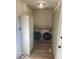 Bright laundry room features modern washer and dryer at 916 N County Road 500 E, Avon, IN 46123