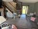 Comfortable living room with a fireplace and staircase, featuring a rocking chair near the front door at 916 N County Road 500 E, Avon, IN 46123