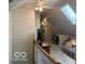Loft area showcasing a vaulted ceiling, skylight, television, and comfortable seating at 916 N County Road 500 E, Avon, IN 46123