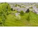 Expansive backyard featuring a gazebo, manicured lawn, garden, mature trees, and serene neighborhood setting at 9598 N Mariners Crst, McCordsville, IN 46055