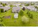 Spacious backyard featuring a gazebo, manicured lawn, garden, mature trees and an outdoor hot tub at 9598 N Mariners Crst, McCordsville, IN 46055