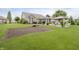 Well-maintained backyard with a patio, gazebo, lush lawn, and garden space perfect for outdoor enjoyment at 9598 N Mariners Crst, McCordsville, IN 46055