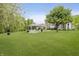 Expansive, well-maintained backyard features a gazebo with outdoor seating, lush green grass, and mature trees at 9598 N Mariners Crst, McCordsville, IN 46055
