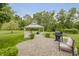 Backyard gazebo featuring white furniture and grill area at 9598 N Mariners Crst, McCordsville, IN 46055