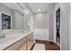 Bright bathroom with dual sink vanity, soaking tub, closet, and wood-look floors at 9598 N Mariners Crst, McCordsville, IN 46055