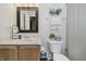 Small bathroom with a sink, toilet, mirror, and shower curtain at 9598 N Mariners Crst, McCordsville, IN 46055