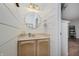 Stylish powder room featuring shiplap walls, updated vanity, and round mirror at 9598 N Mariners Crst, McCordsville, IN 46055