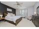 Inviting main bedroom with dark accent wall, comfortable seating and plenty of natural light at 9598 N Mariners Crst, McCordsville, IN 46055
