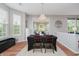 Open dining room with modern light fixture and plenty of natural light at 9598 N Mariners Crst, McCordsville, IN 46055