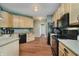 Spacious kitchen with stainless steel appliances, neutral cabinets and granite countertops at 9598 N Mariners Crst, McCordsville, IN 46055