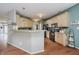 Well-lit kitchen features neutral cabinets, stainless appliances and granite countertops at 9598 N Mariners Crst, McCordsville, IN 46055