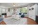 Spacious living room featuring hardwood floors, a ceiling fan, and ample seating at 9598 N Mariners Crst, McCordsville, IN 46055