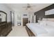 Spacious main bedroom featuring neutral walls, dark trim, ensuite access, and ceiling fan at 9598 N Mariners Crst, McCordsville, IN 46055