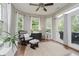 Cozy sun room with plenty of windows and outdoor access to spa at 9598 N Mariners Crst, McCordsville, IN 46055