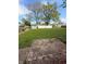 Landscaped backyard with grass, mature trees, a shed and privacy fencing at 1011 N 10Th St, Elwood, IN 46036