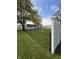Well maintained fenced backyard featuring mature trees and a utility shed at 1011 N 10Th St, Elwood, IN 46036