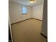 A carpeted bedroom featuring one window for natural light at 1011 N 10Th St, Elwood, IN 46036