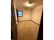 A bedroom with neutral carpet and a window featuring decorative curtain at 1011 N 10Th St, Elwood, IN 46036