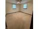 Bedroom with neutral carpet, ceiling fan and two windows at 1011 N 10Th St, Elwood, IN 46036