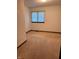 A clean and well-lit room with neutral carpet and a window providing natural light at 1011 N 10Th St, Elwood, IN 46036