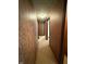 A hallway with textured walls and ceiling and neutral carpeting at 1011 N 10Th St, Elwood, IN 46036