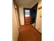 Hallway featuring tile floors, wallpaper and neutral-toned walls at 1011 N 10Th St, Elwood, IN 46036