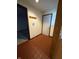 Hallway featuring tile floors, coat hooks and neutral-toned walls at 1011 N 10Th St, Elwood, IN 46036
