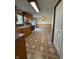 Eat-in kitchen featuring wood cabinets, sleek appliances, and sliding glass doors at 1011 N 10Th St, Elwood, IN 46036