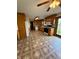 Eat-in kitchen featuring wood cabinets, sleek appliances, and sliding glass doors to the backyard at 1011 N 10Th St, Elwood, IN 46036