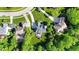 Aerial view of the home featuring mature trees and lush landscaping at 10390 Tremont Dr, Fishers, IN 46037