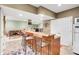 Basement features a bar with seating and a living area, perfect for entertaining at 10390 Tremont Dr, Fishers, IN 46037