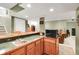Basement wet bar area features granite countertops and wooden cabinetry with a sink at 10390 Tremont Dr, Fishers, IN 46037