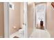 Bathroom with toilet and view through the hallway at 10390 Tremont Dr, Fishers, IN 46037